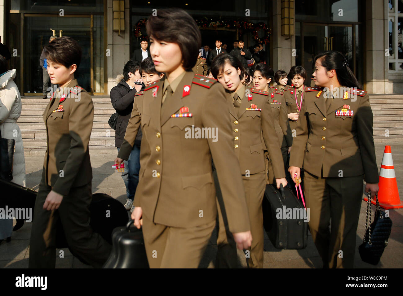 Members of North Korean pop group Moranbong Band leave a hotel for a