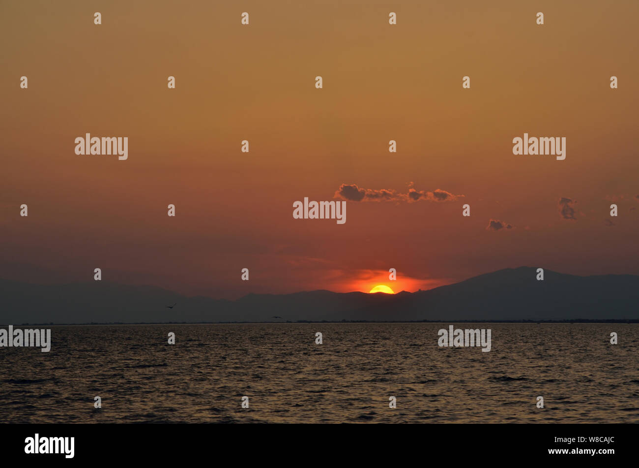 Landscape with sea at sunset Stock Photo - Alamy