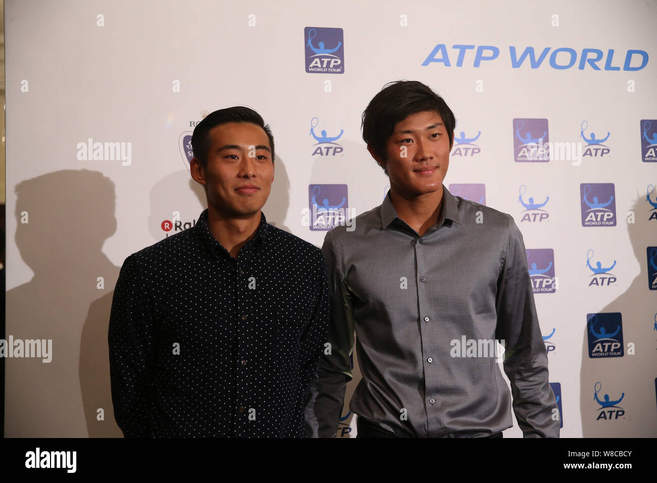Zhang Ze, left, and Zhang Zhizhen of China pose during the 