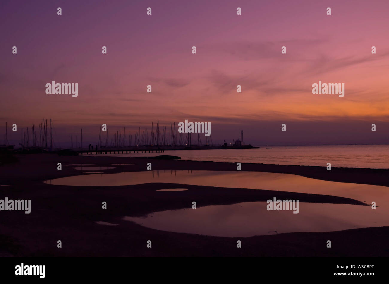 Beach After Rian Scene in beach after rain with silhouettes of sails and a chapel at ...