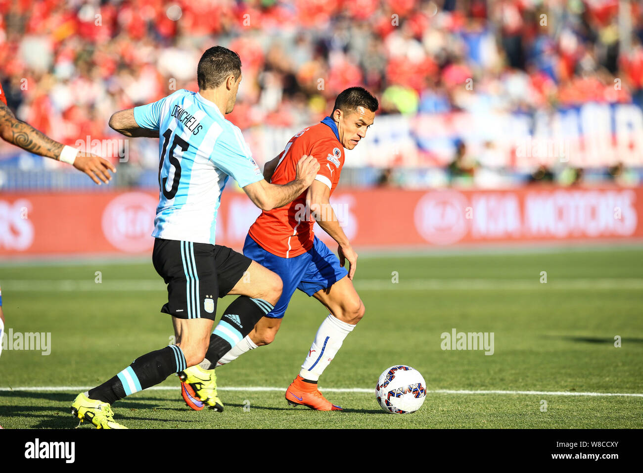 Argentina's Martin Demichelis, left, challenges Chile's Alexis Sanchez, right, during the Copa America 2015 final soccer match between Chile and Argen Stock Photo