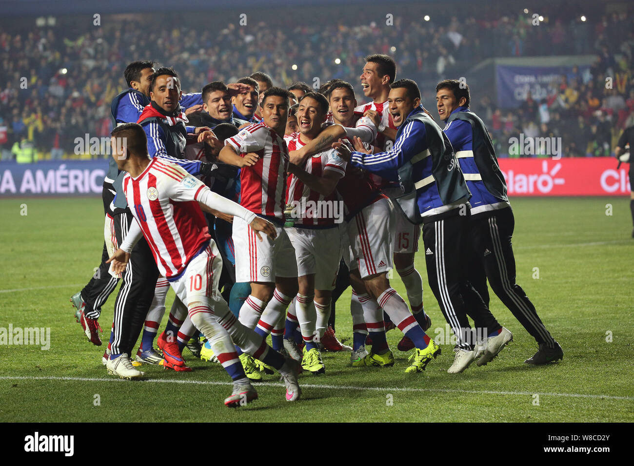 Paraguay's players celebrate after the penalty shoot-out during the