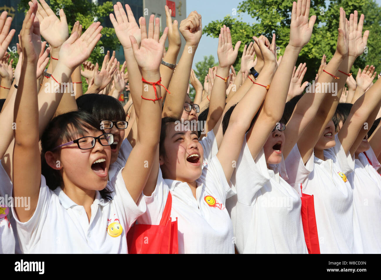 Chinese students cheer for themselves before taking part in the first