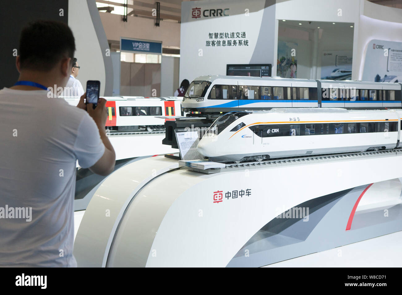 FILE--A visitor takes photos of model trains at the stand of CRRC (China  Railway Rolling Stock Corp Ltd) during the UrTran 2015 International Urban  Stock Photo - Alamy