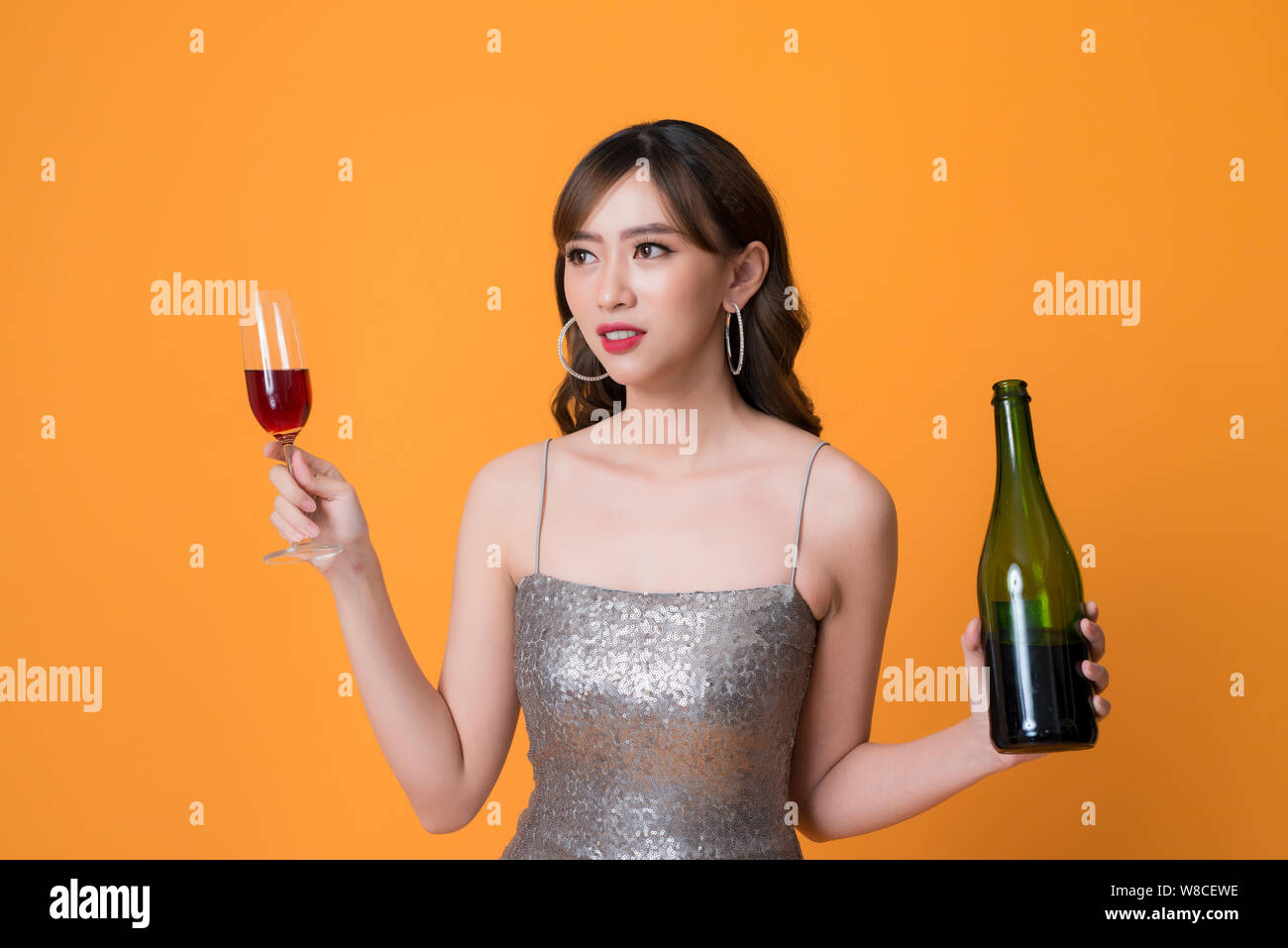 Woman with a glass of wine hi-res stock photography and images - Alamy