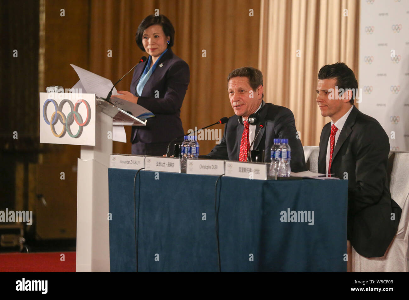 Alexander Zhukov, center, head of the 2022 Evaluation Commission for the International Olympic Committee (IOC), speaks next to Christophe Dubi, right, Stock Photo