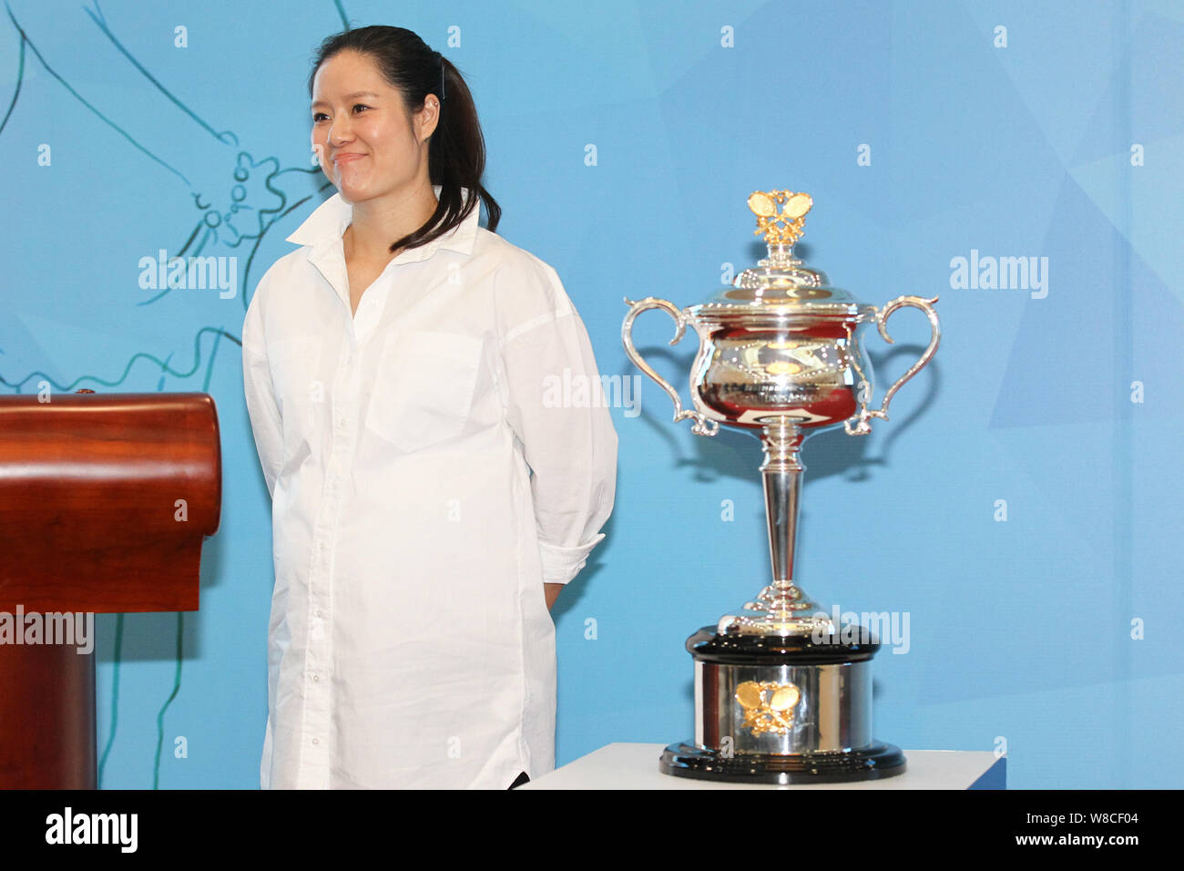 Retired Chinese tennis star Li Na poses during a charity event for pregnant women in Beijing, China, 26 March 2015. Stock Photo