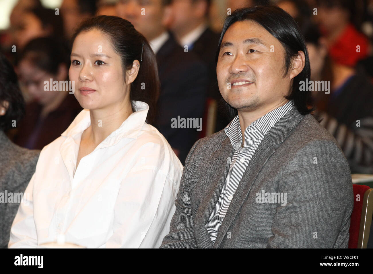 Retired Chinese tennis star Li Na, left, and her husband Jiang Shan attend a charity event for pregnant women in Beijing, China, 26 March 2015. Stock Photo