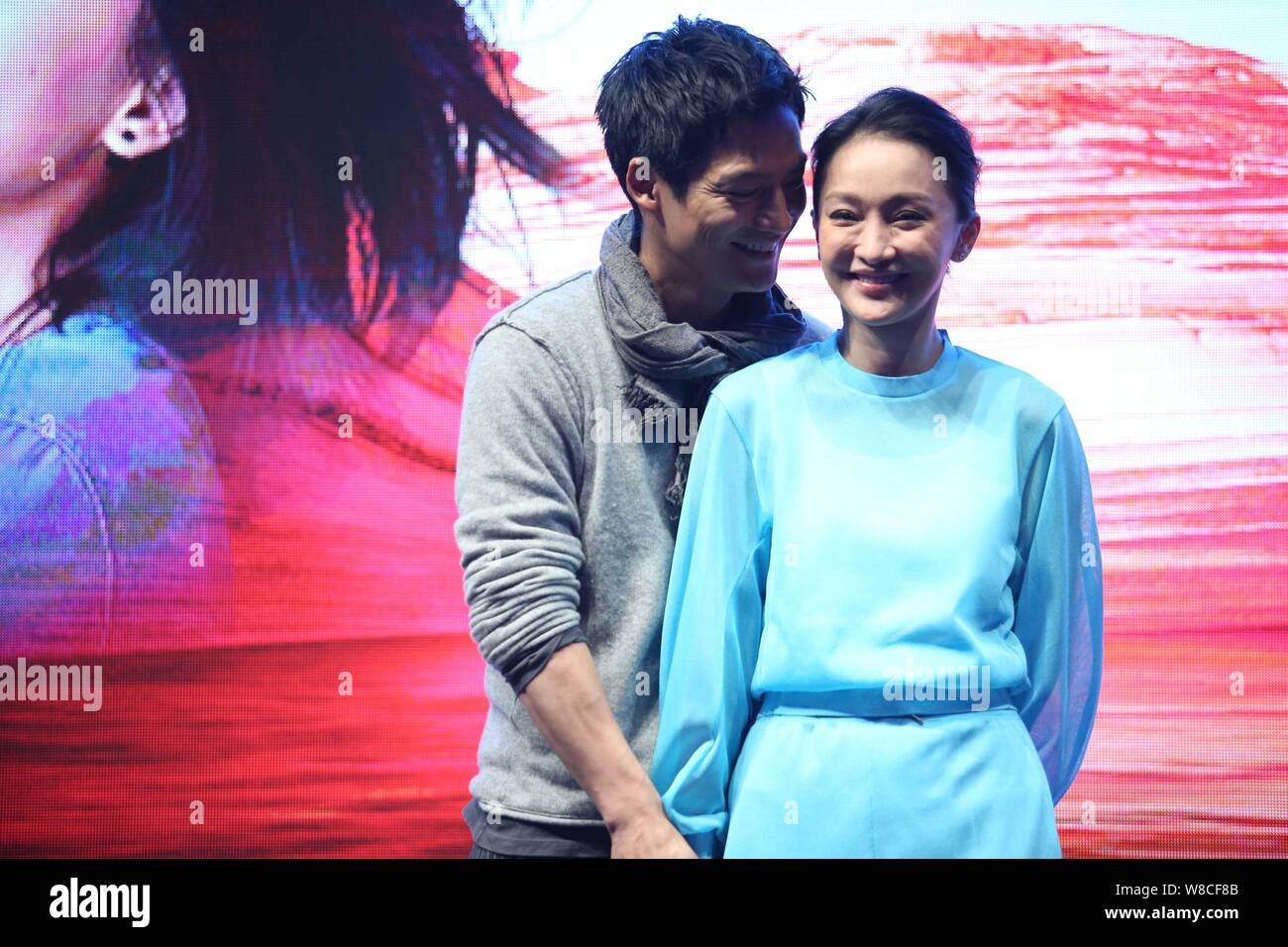 Chinese actress Zhou Xun, right, and her American actor husband Archie Kao smile during a premiere event for the micro film "Dream Escape" to promote Stock Photo