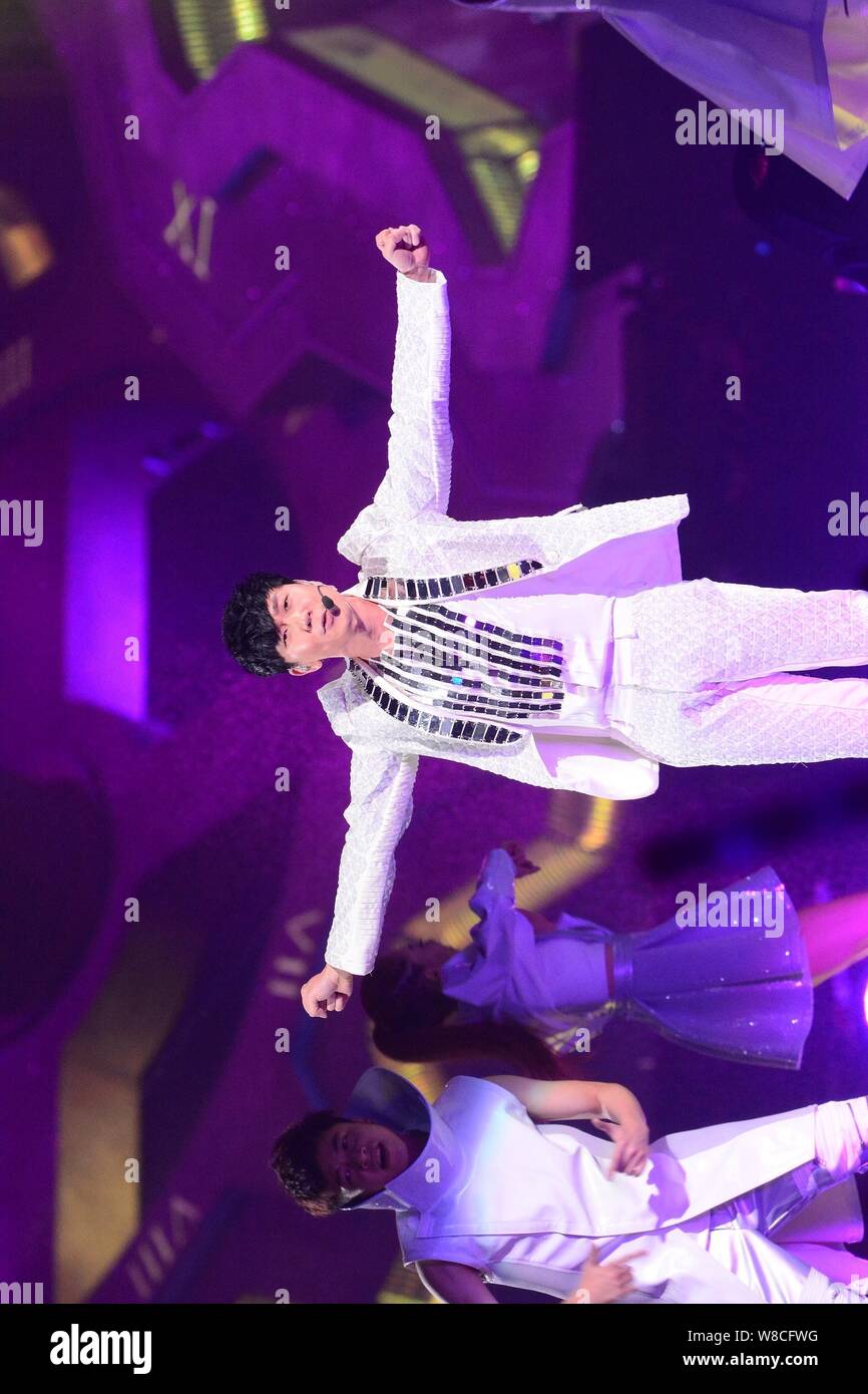 Singaporean singer JJ Lin performs during his concert in Taipei, Taiwan, 14 February 2015. Stock Photo