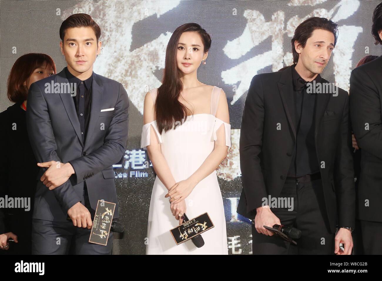 (From left) South Korean actor Choi Siwon, Chinese actress Wang Ruoxin and American actor Adrien Brody attend a press conference for their new movie ' Stock Photo