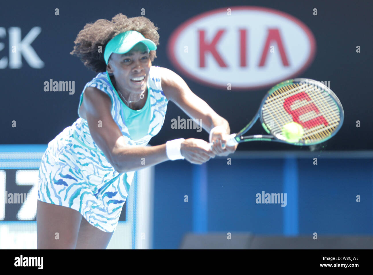 Venus Williams of the U.S. returns a shot to Camila Giorgi of Italy during their third round match at the Australian Open tennis tournament in Melbour Stock Photo