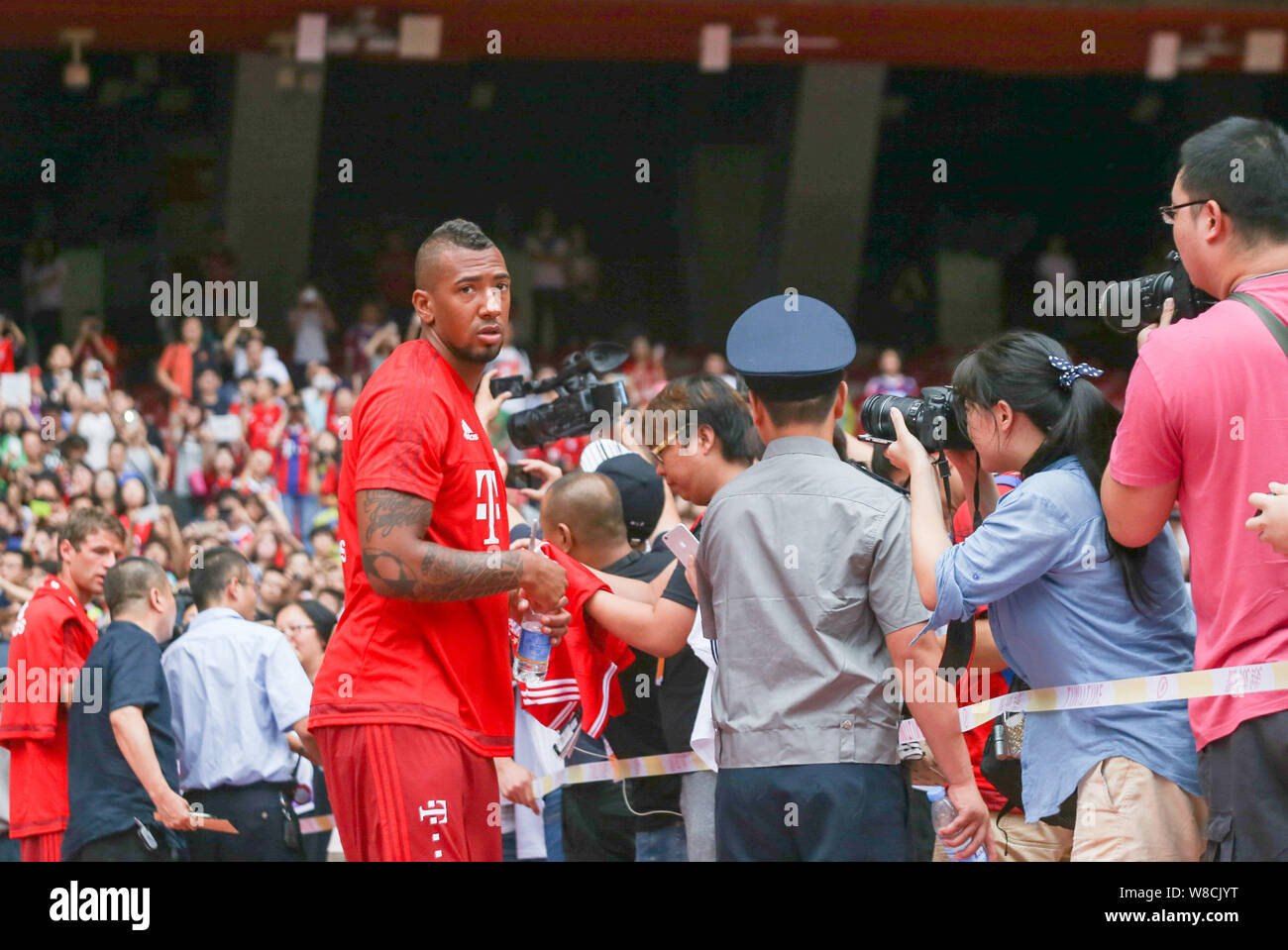 Jerome Boateng of Bayern Munich FC, center, arrives at a training session for the Audi Football Summer Tour China 2015 in Beijing, China, 17 July 2015 Stock Photo