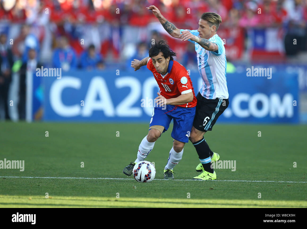 Argentina's Lucas Biglia, right, challenges Chile's Jorge Valdivia, left, during the Copa America 2015 final soccer match between Chile and Argentina Stock Photo