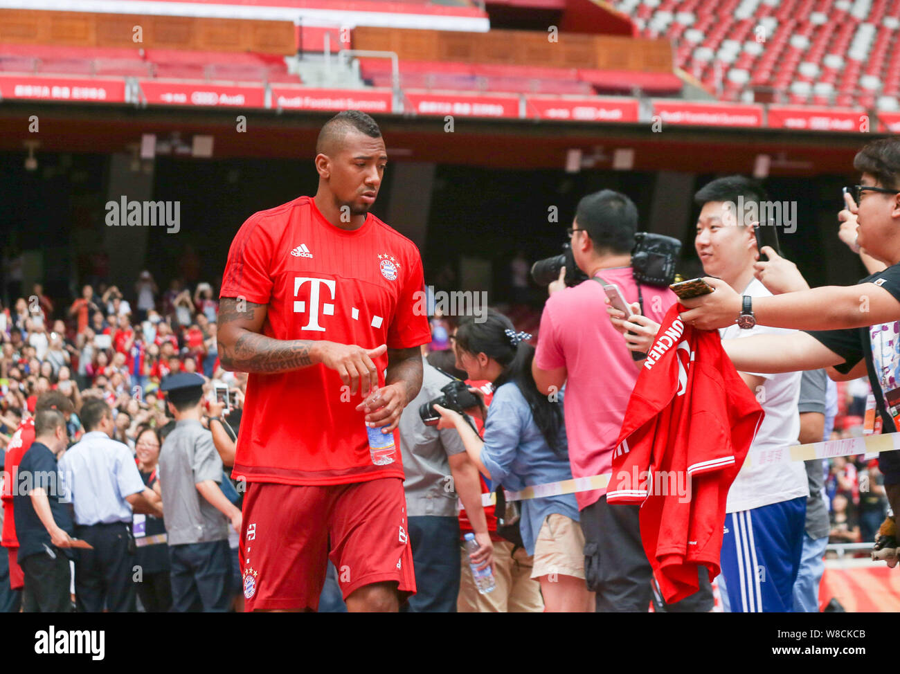 Jerome Boateng of Bayern Munich FC, left, arrives at a training session for the Audi Football Summer Tour China 2015 in Beijing, China, 17 July 2015. Stock Photo