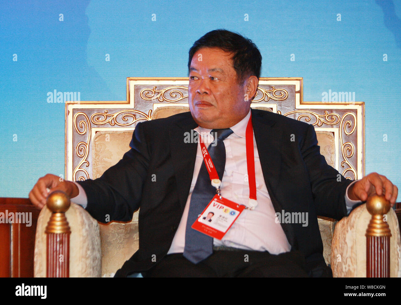 --FILE--Cho Tak Wong (Cao Dewang), Chairman of Fuyao Group and Chairman of Fuyao Glass Industry Group Co., Ltd., listens at a forum during the 12th Wo Stock Photo