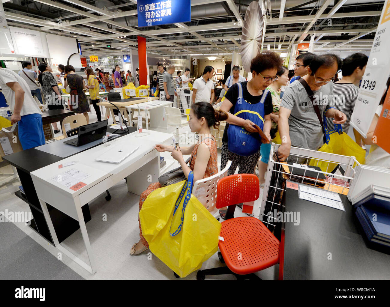 --FILE--Chinese customers shop for furnishings at a store of IKEA in Hangzhou city, east China's Zhejiang province, 25 June 2015.   Consumer sentiment Stock Photo
