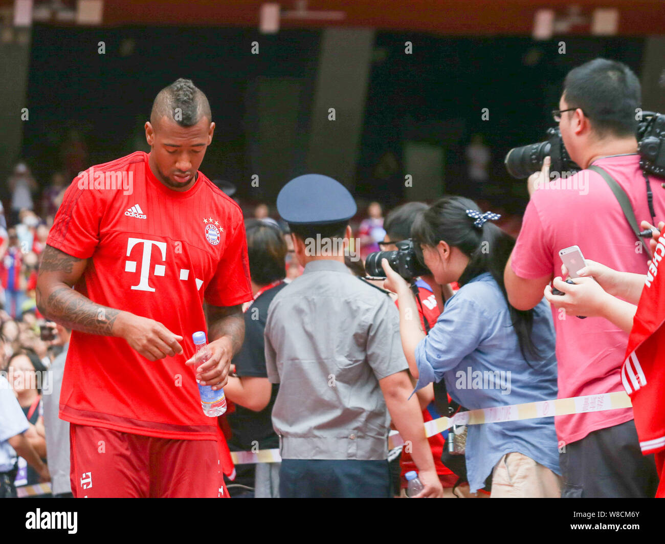 Jerome Boateng of Bayern Munich FC, left, arrives at a training session for the Audi Football Summer Tour China 2015 in Beijing, China, 17 July 2015. Stock Photo
