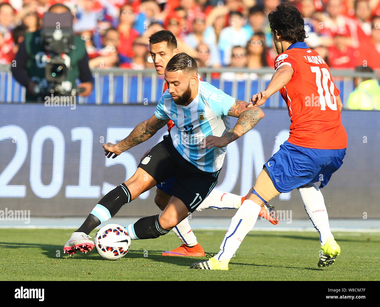 Chile's Jorge Valdivia, right, challenges Argentina's Nicolas Otamendi, left, during the Copa America 2015 final soccer match between Chile and Argent Stock Photo