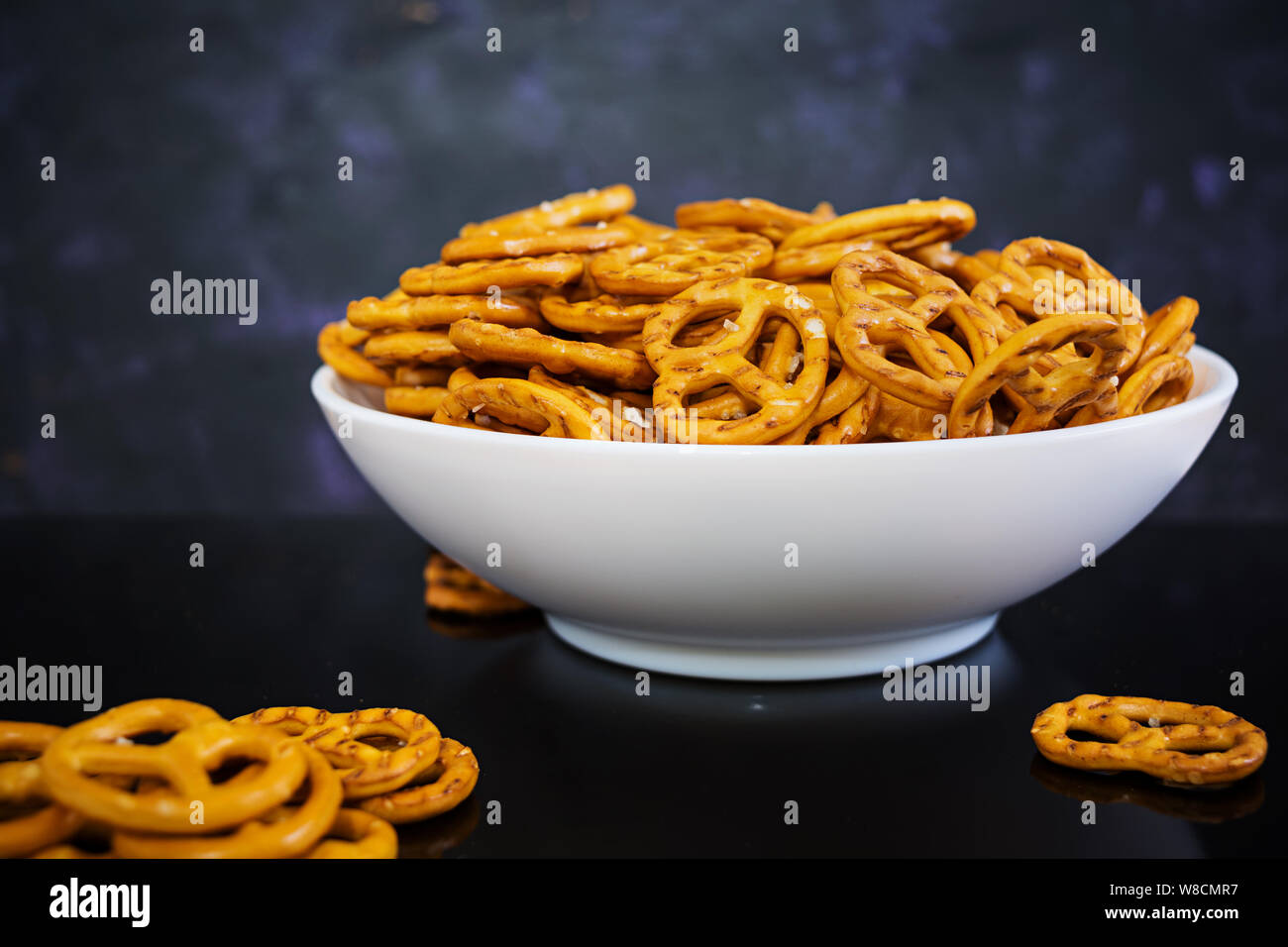 Salted pretzel on dark background Stock Photo