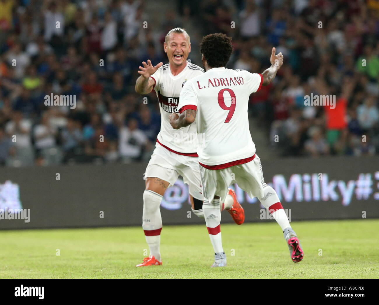 Philippe Mexes Of Ac Milan Center Celebrates With Luiz Adriano Souza Da Silva After Scoring A Goal Against Inter Milan In A Soccer Match During The Stock Photo Alamy