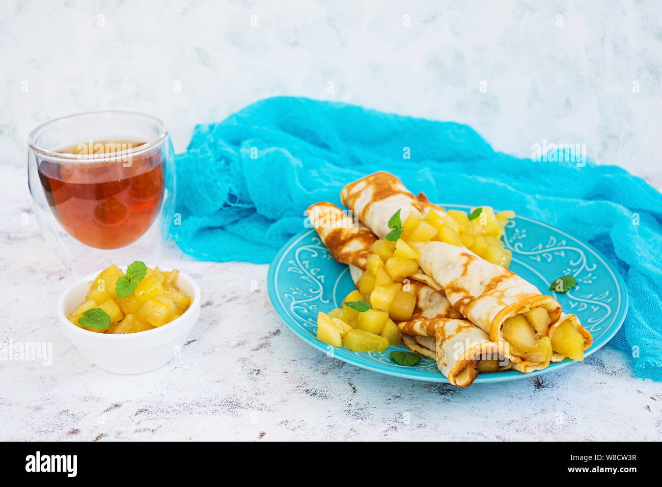Pancakes with apples on white background Stock Photo