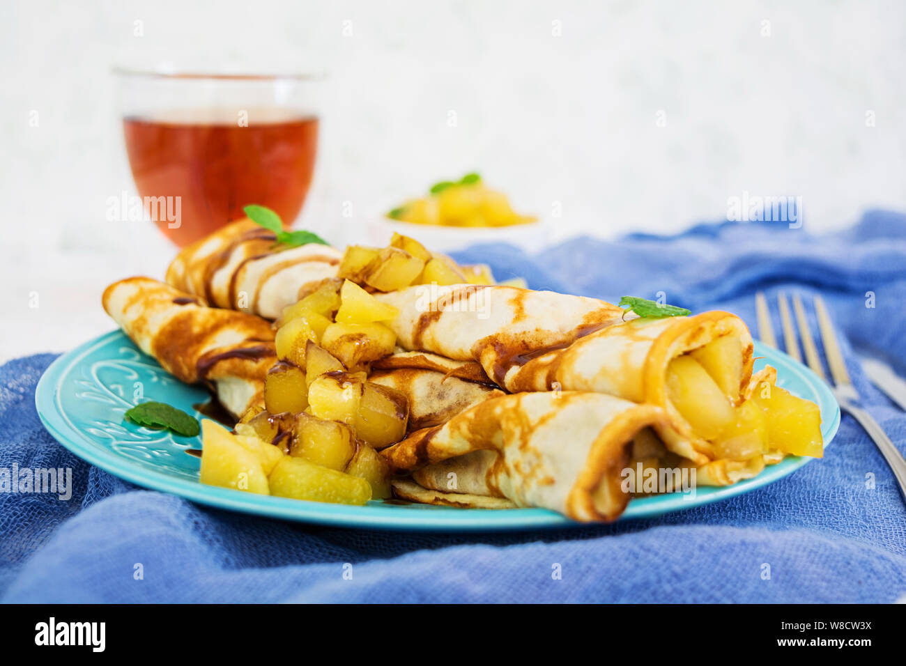 Pancakes with apples on white background Stock Photo