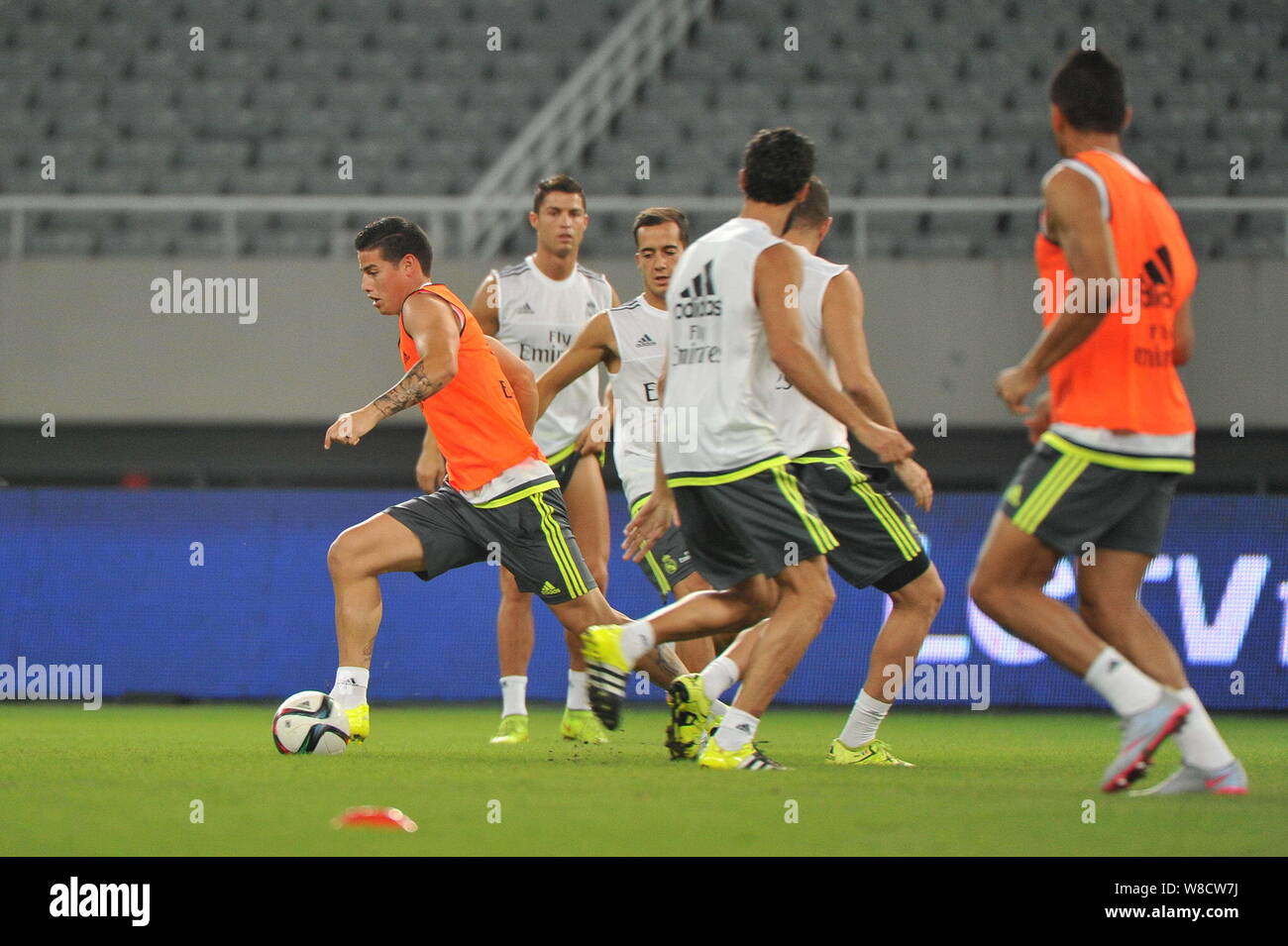 Cristiano Ronaldo, back, James Rodriguez, left, and teammates of Real Madrid take part in a training session in Shanghai, China, 29 July 2015. Stock Photo