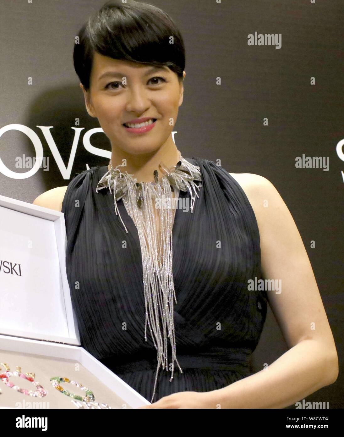 Hong Kong singer Gigi Leung poses during a promotional event for Swarovski in Shanghai, China, 11 June 2015. Stock Photo