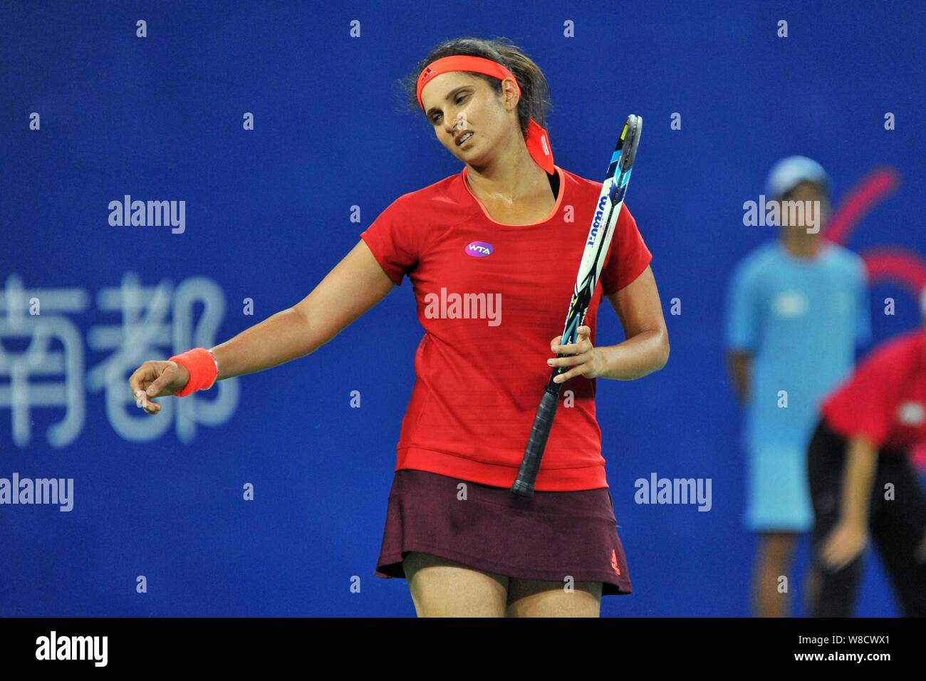 Sania Mirza of India reacts after she and Martina Hingis of Switzerland lost scores to Monica Niculescu of Romania and Anna-Lena Friedsam of Germany i Stock Photo