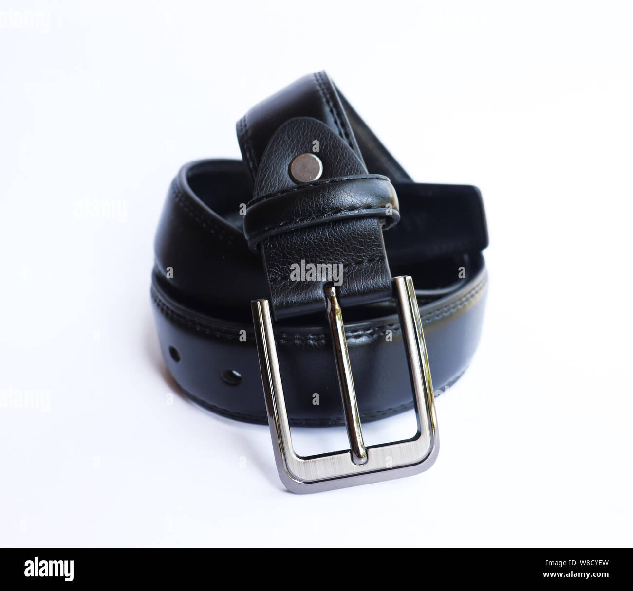 Black leather belt on isolated white background Stock Photo - Alamy
