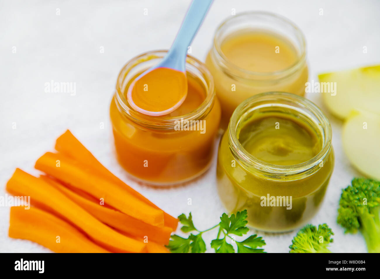Baby food. Mashed vegetables and fruits in jars. Selective focus ...