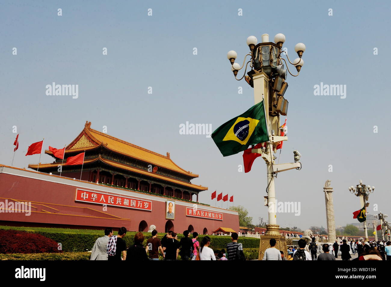 --FILE--Chinese and Brazilian national flags flutter on a lamppost on the Tiananmen Square during the visit of Brazilian President Dilma Rousseff in B Stock Photo