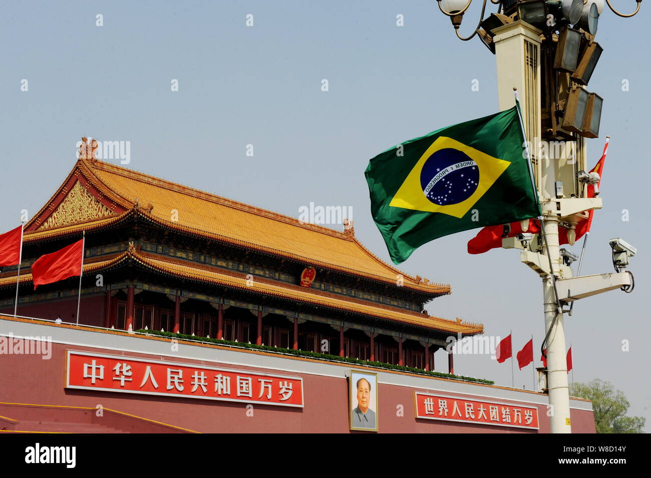 --FILE--Chinese and Brazilian national flags flutter on a lamppost on the Tiananmen Square during the visit of Brazilian President Dilma Rousseff in B Stock Photo