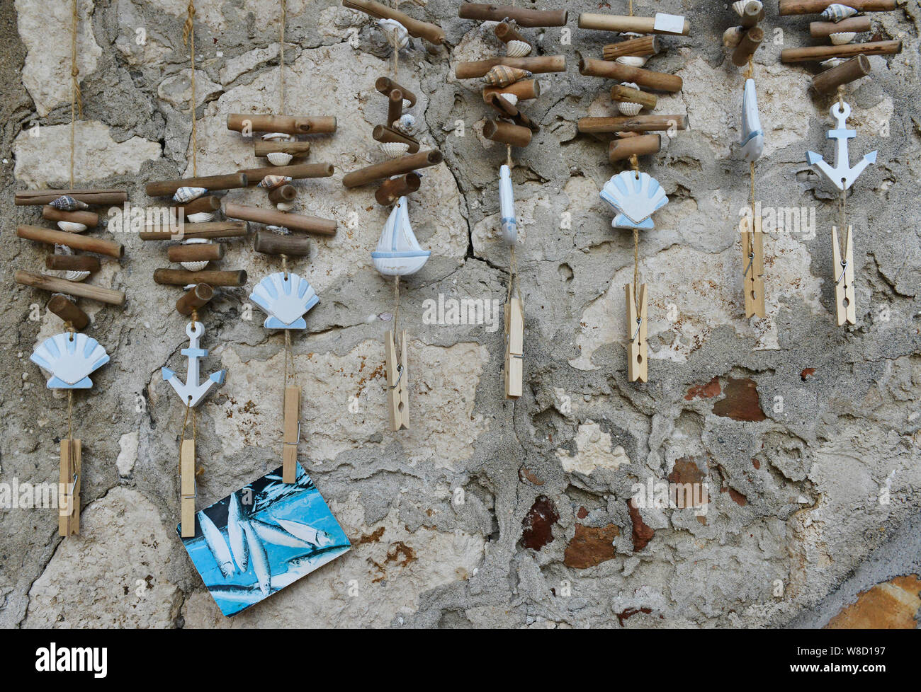 Maritime wind chimes/ photo holder hanging outside on a wall of a souvenir shop in Rovinj, Istria, Croatia, Europe. Stock Photo