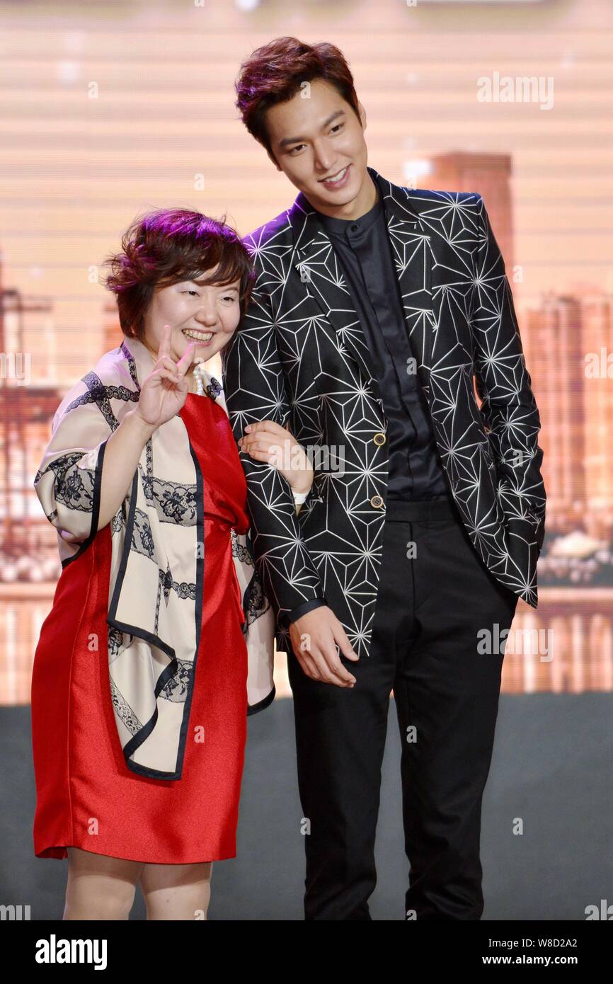 South Korean actor Lee Min-ho, right, poses with a fan during a promotional event for LG new product in Guangzhou city, south China's Guangdong provin Stock Photo