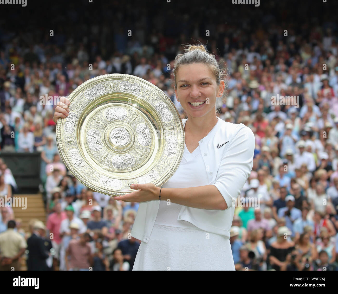 Portrait of Romanian tennis player Simona Halep posing with trophy during trophy presentation in 2019 Wimbledon Championships, London, England, United Stock Photo