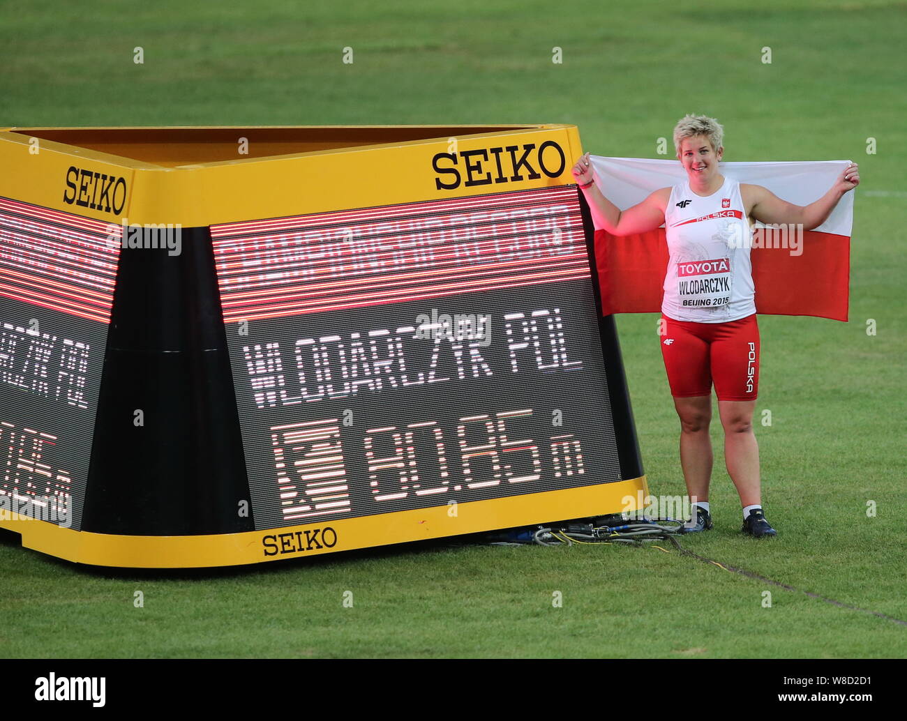 Poland's Anita Wlodarczyk poses for photos after winning the gold medal