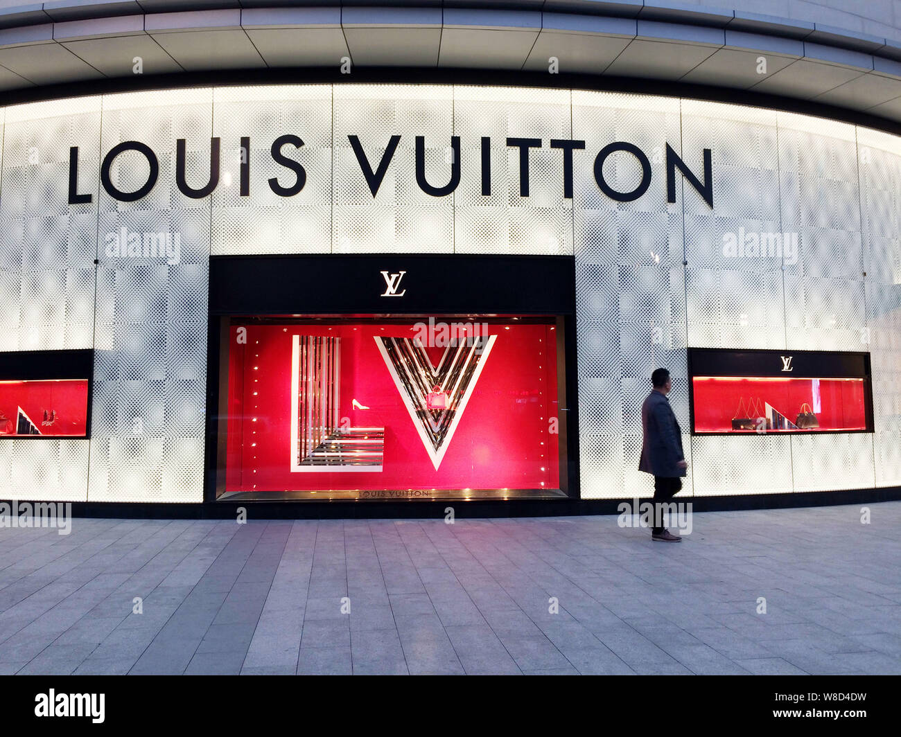 FILE--Pedestrians walk past a Louis Vuitton (LV) boutique of LVMH Moet  Hennessy Louis Vuitton SA in Hong Kong, China, 20 July 2015. LVMH Moet He  Stock Photo - Alamy