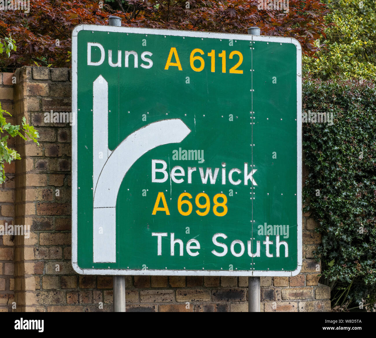 A road sign for Duns and Berwick in Coldstream, Scottish Borders, UK. Stock Photo