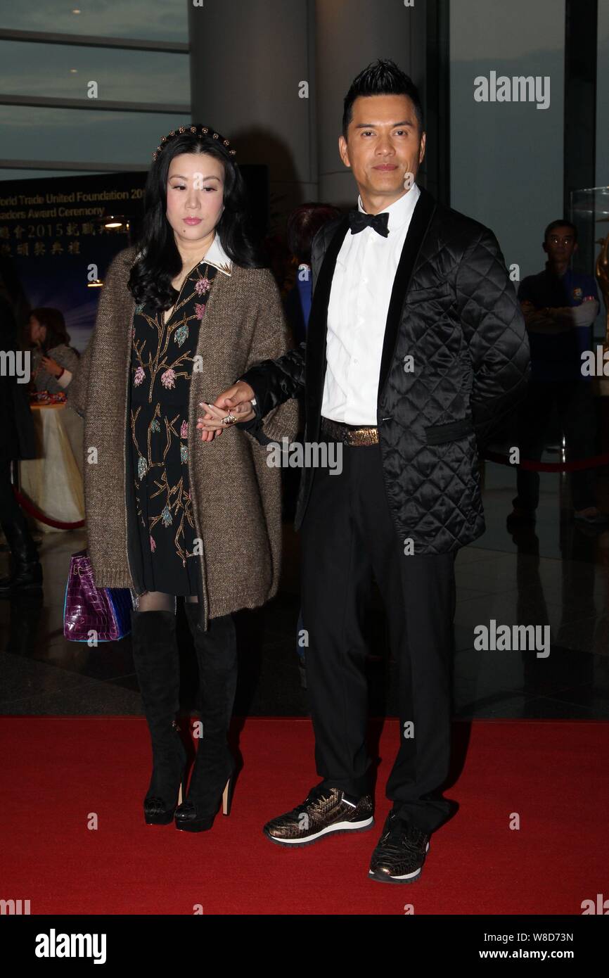 Hong Kong actor Ray Lui Leung-wai, right, poses with his wife on the red carpet for the Inauguration Ceremony of World Trade United Foundation 2015, a Stock Photo