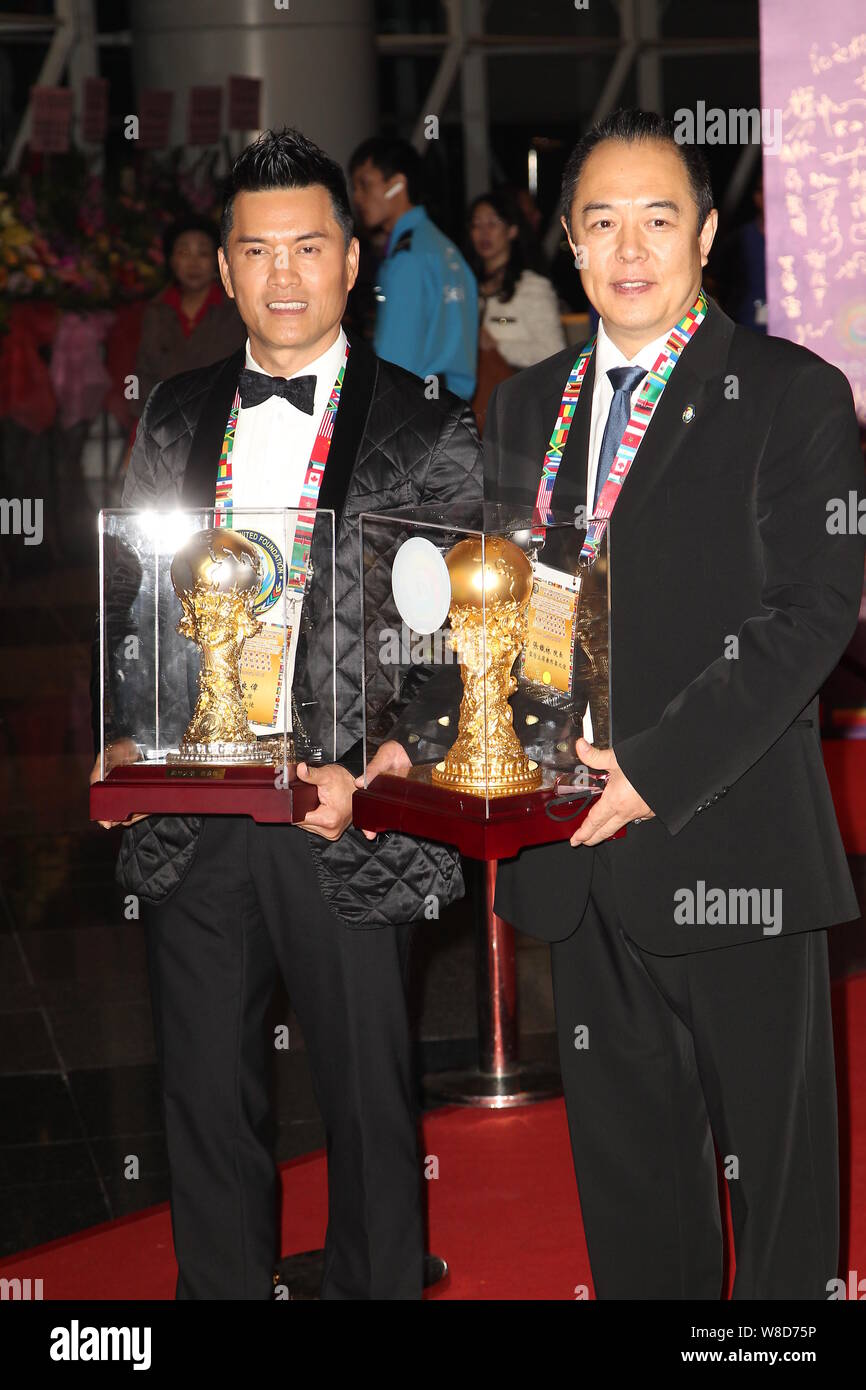 Hong Kong actor Ray Lui Leung-wai, left, and Chinese-born British actor Zhang Tielin pose with their trophies on the red carpet for the Inauguration C Stock Photo