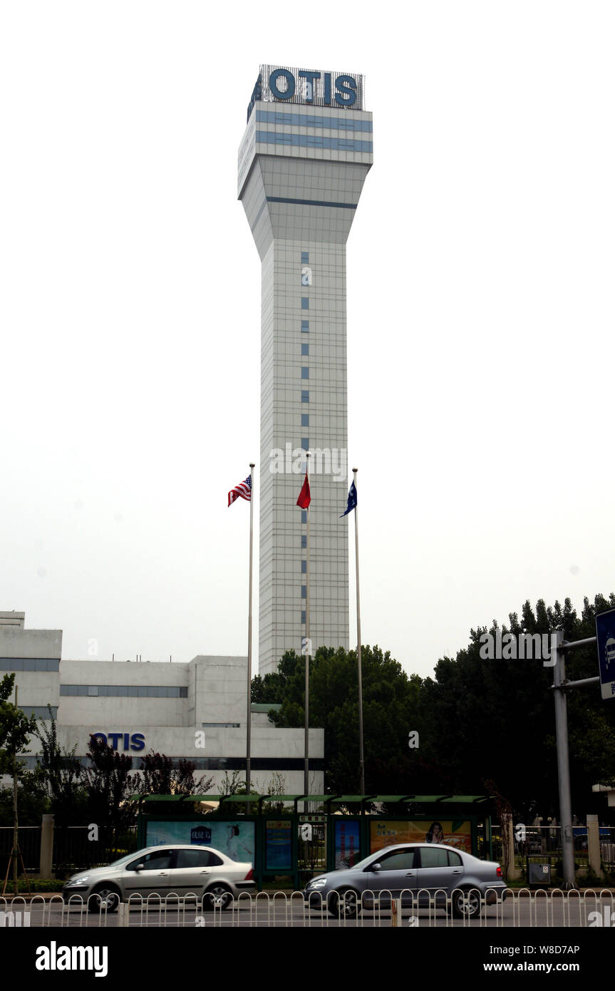 --FILE--Cars run past Otis Elevator Company in Tianjin, China, 17 July 2011.     United Technologies Corp (UTX.N) is unlikely to hit its traditional t Stock Photo