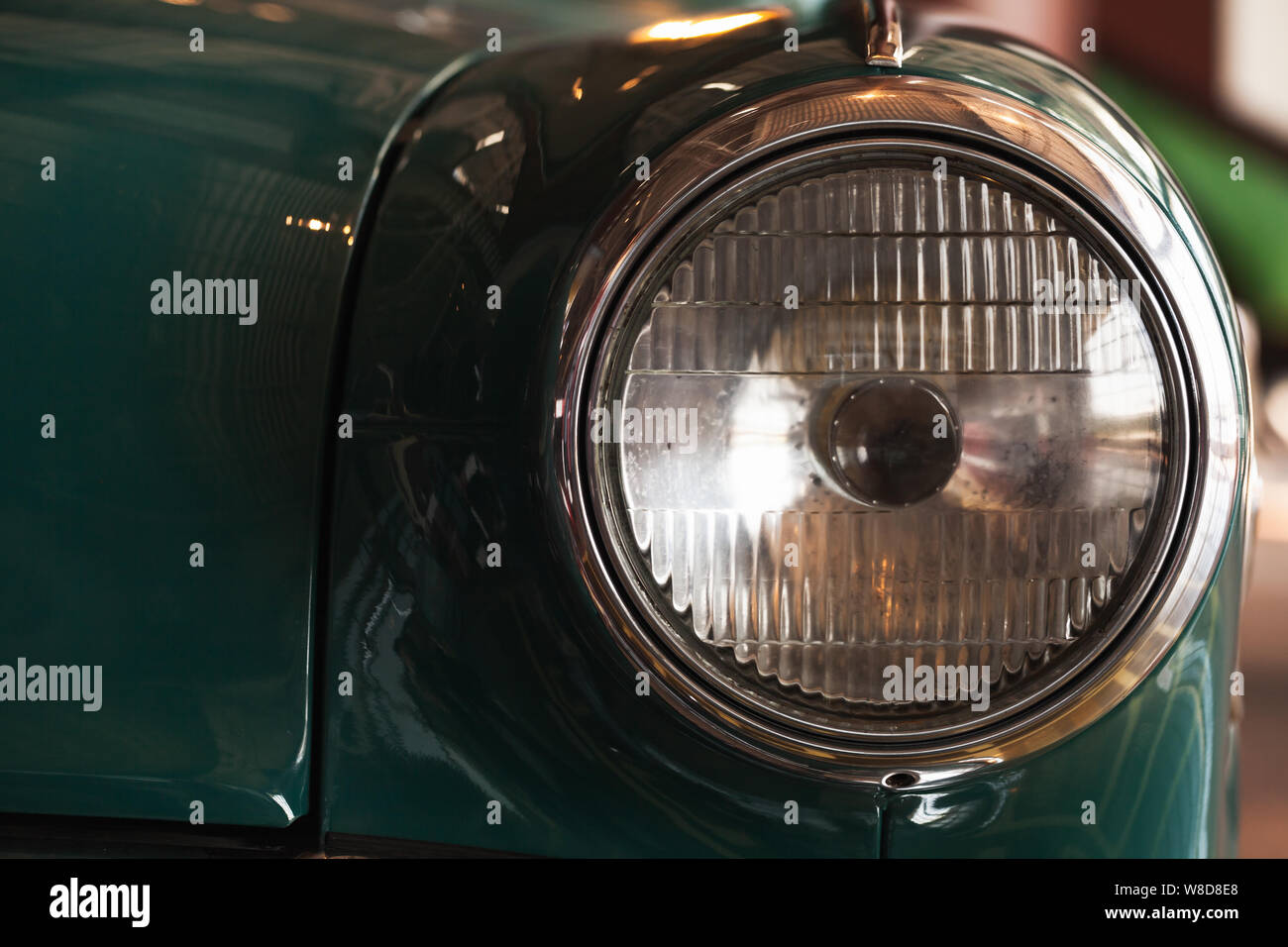 Classic round headlight. Old timer car details. Close up photo with soft selective focus Stock