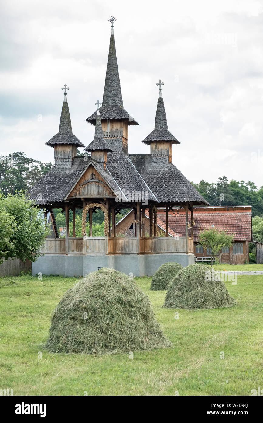 Ieud, Maramureș, Romania. A typical wooden church building for open-air services and gatherings in the middle of this traditional Romanian village Stock Photo