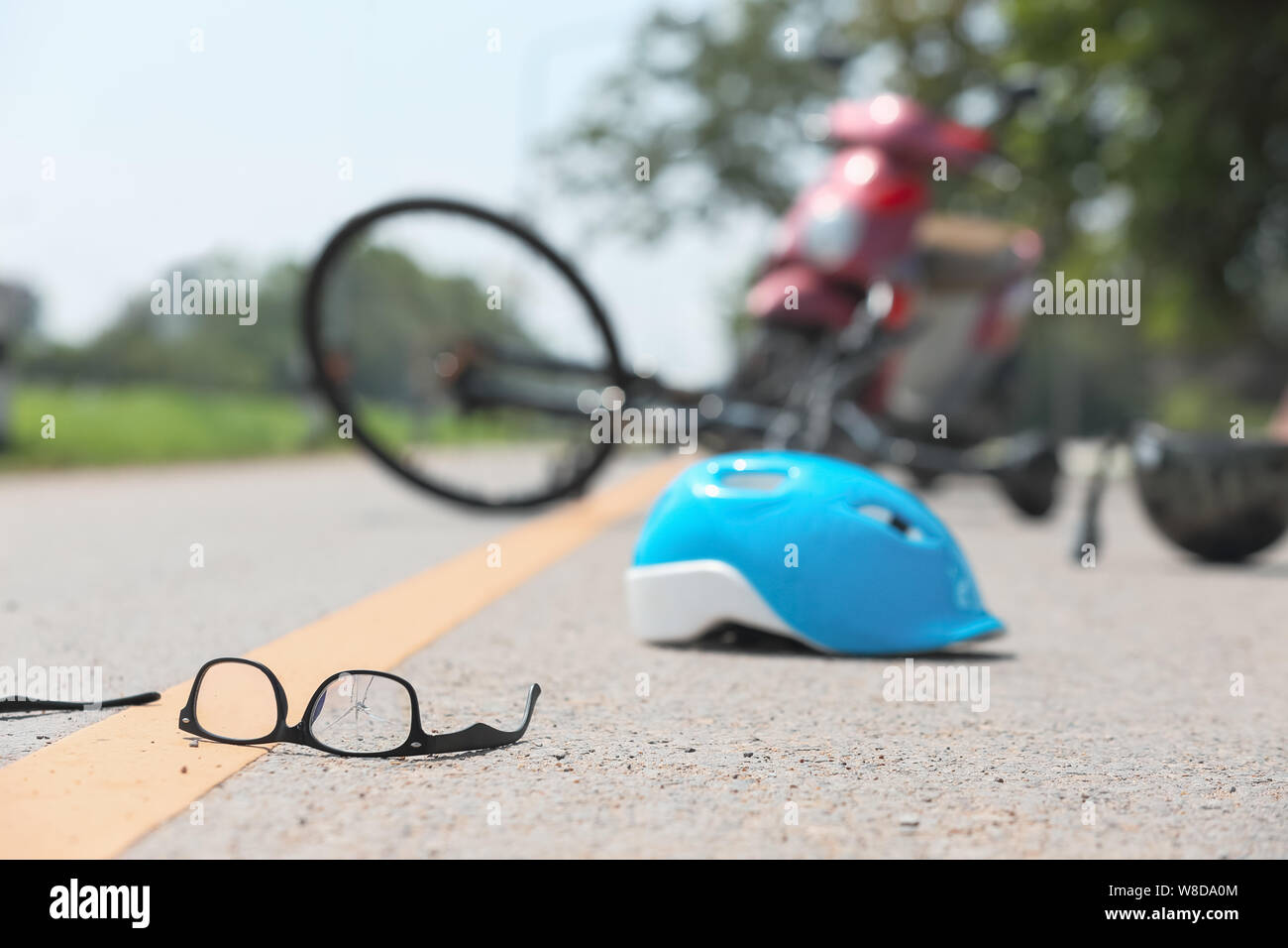 Accident motorcycle crash with bicycle on road Stock Photo