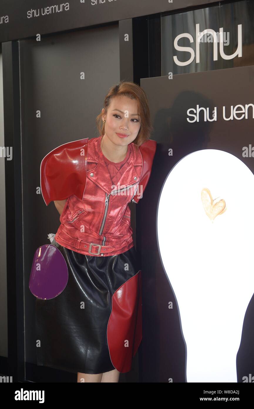 Hong Kong singer Joey Yung poses at a promotional event for Shu Uemura cosmetics in Hong Kong, China, 16 March 2015. Stock Photo