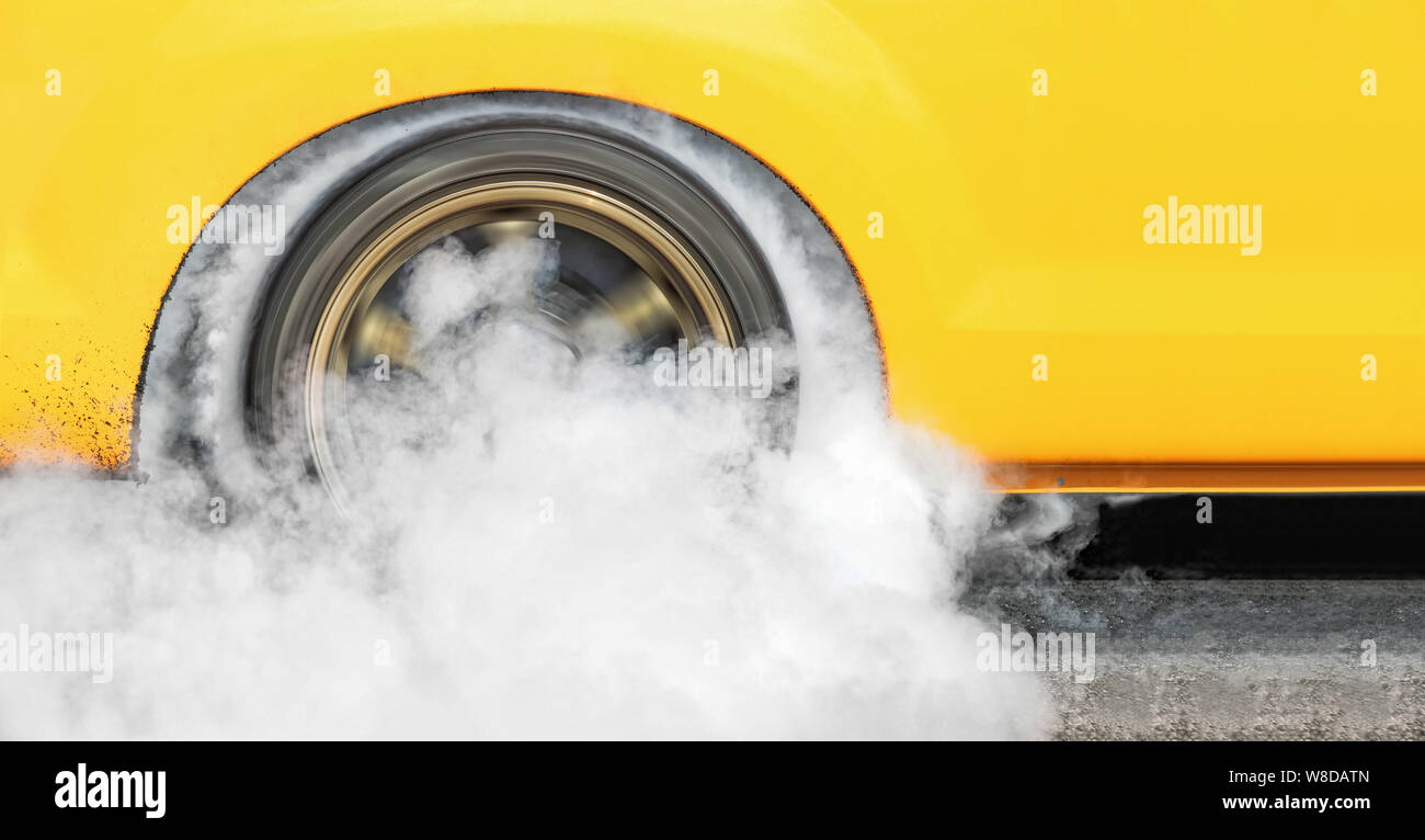 Drag racing car burns rubber off its tires in preparation for the race ...