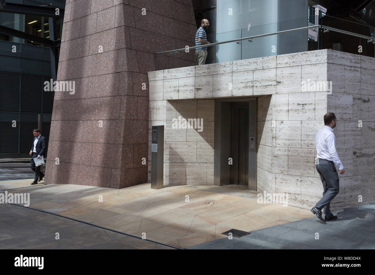 Exchange House City workers pass beneath 1980s architecture of Exchange House ...