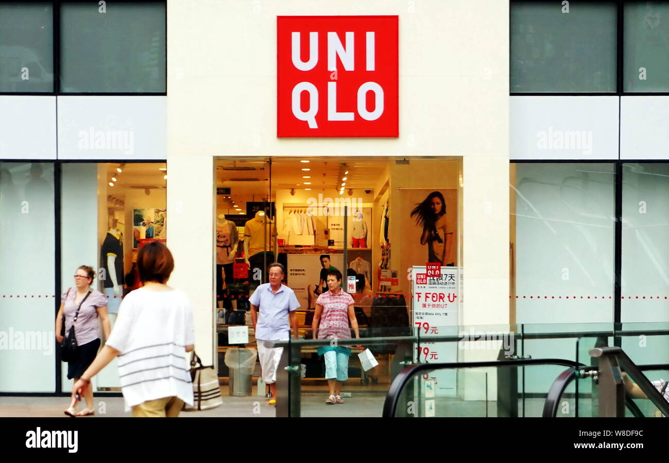 FILE--Customers leave a store of Uniqlo in Shanghai, China, 9 June 2012.  The parent company of Japanese fast-fashion retailer Uniqlo has vowed to  Stock Photo - Alamy